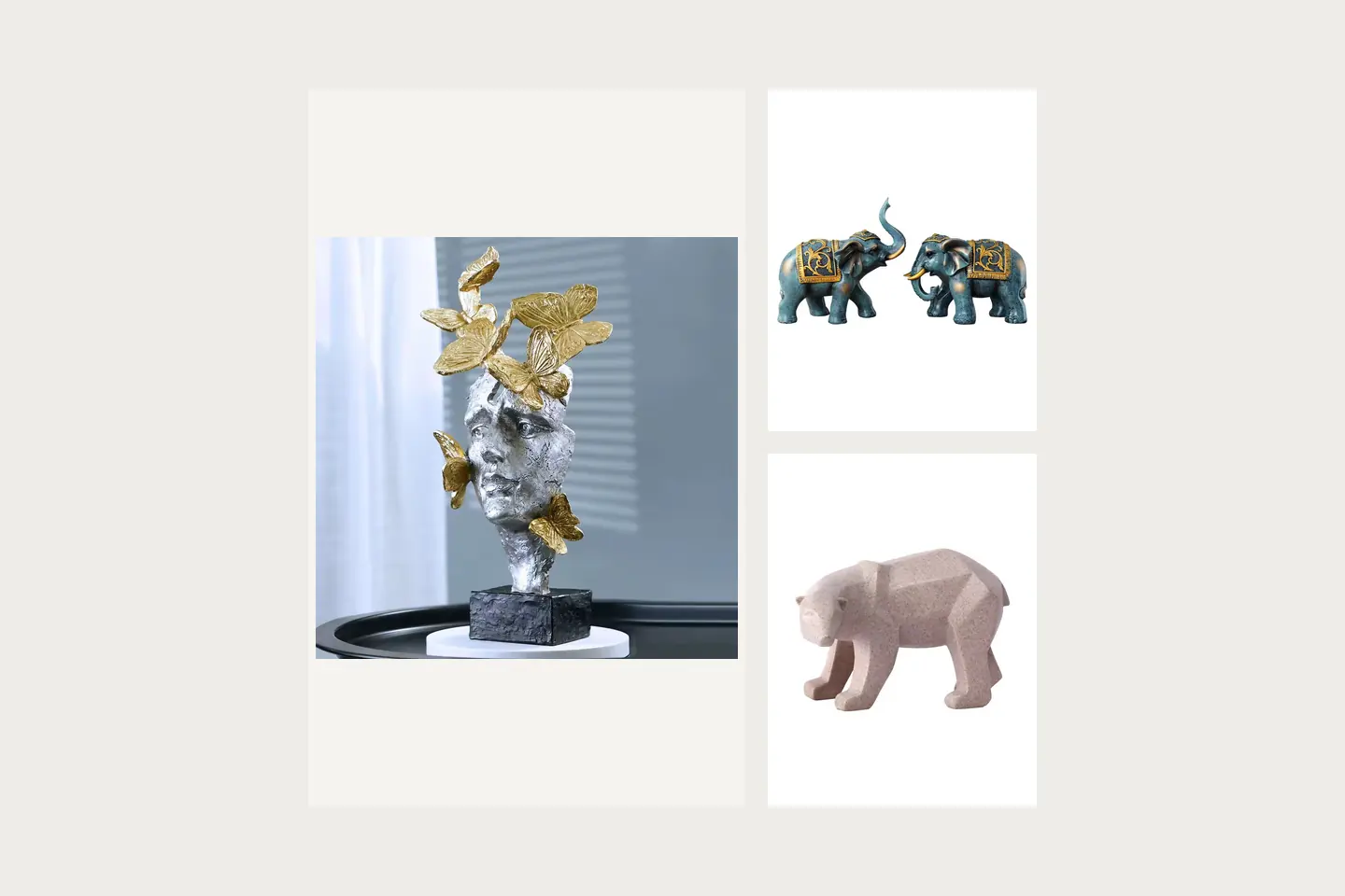 A silver-colored sculpted head decorated with gold-colored butterflies; Two blue-and-gold elephant figurines with patterned saddle blankets; A faceted pale pink bear sculpture with a stone-like surface