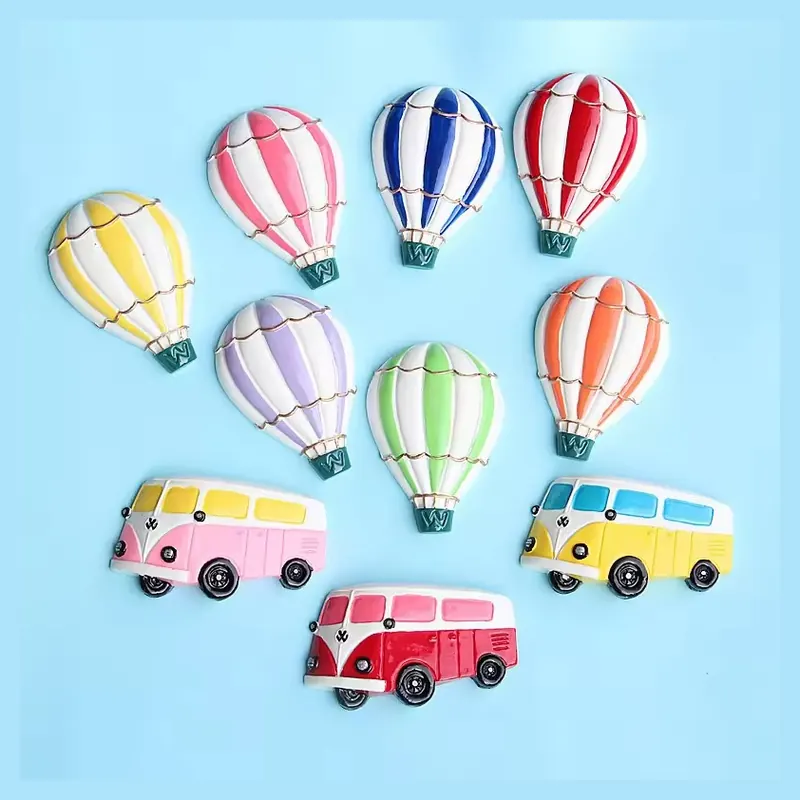 Colorful hot air balloon and camper van refrigerator magnets