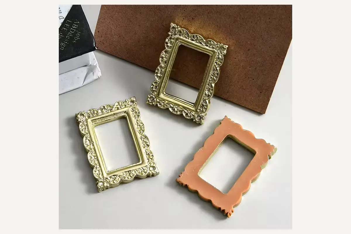 Small ornate frames shown from the front and rear