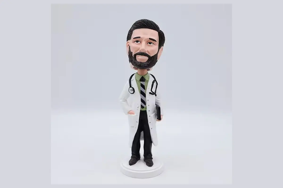 Bearded doctor bobblehead wearing a white coat and stethoscope