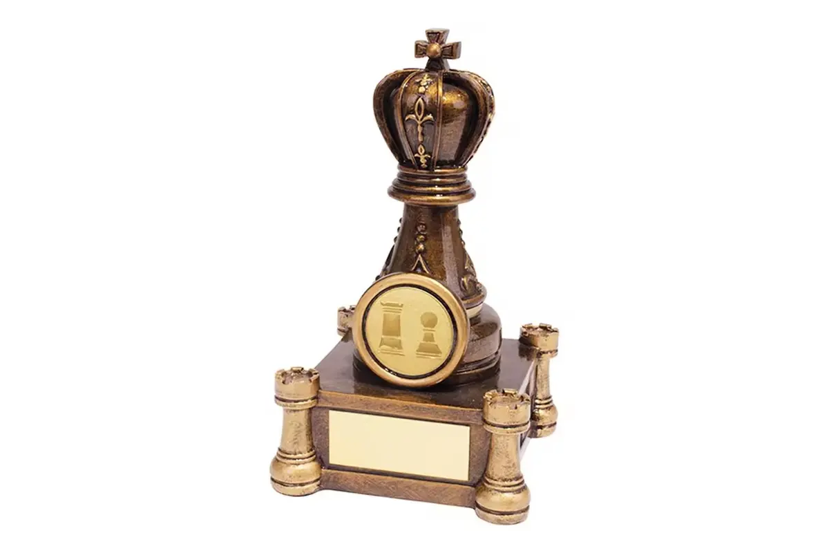 Ornate chess trophy with a crown, chess pieces and blank nameplates