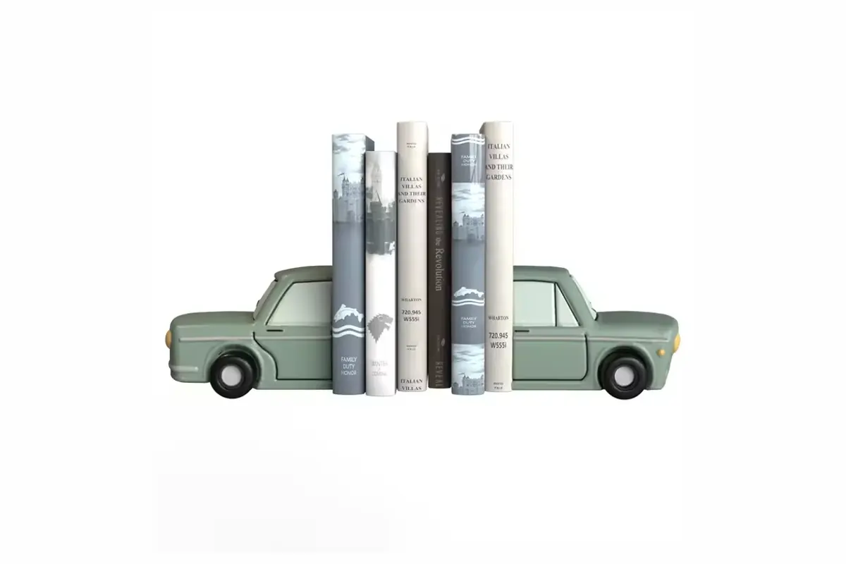 Green car bookends holding a row of books
