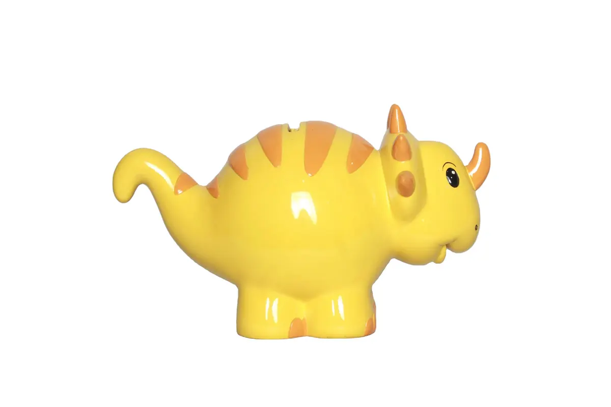 A yellow triceratops coin bank with orange stripes