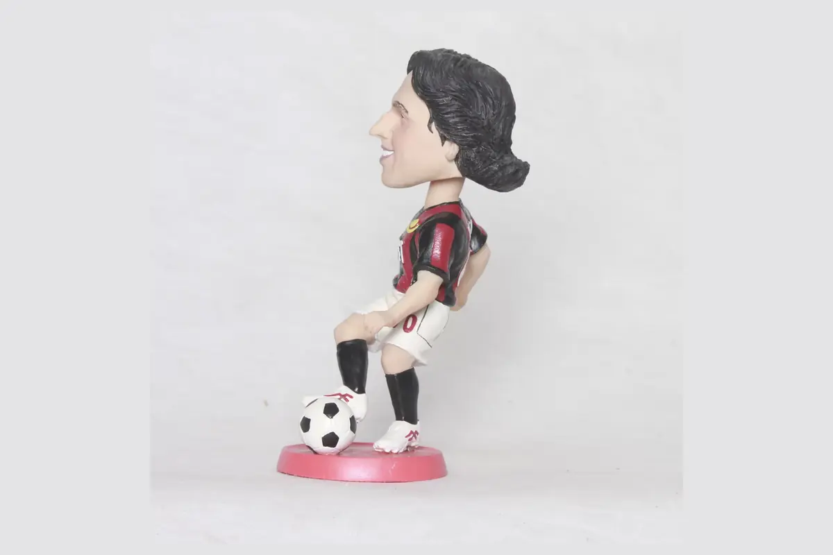 Side view of a football character bobblehead showing its neck clearance