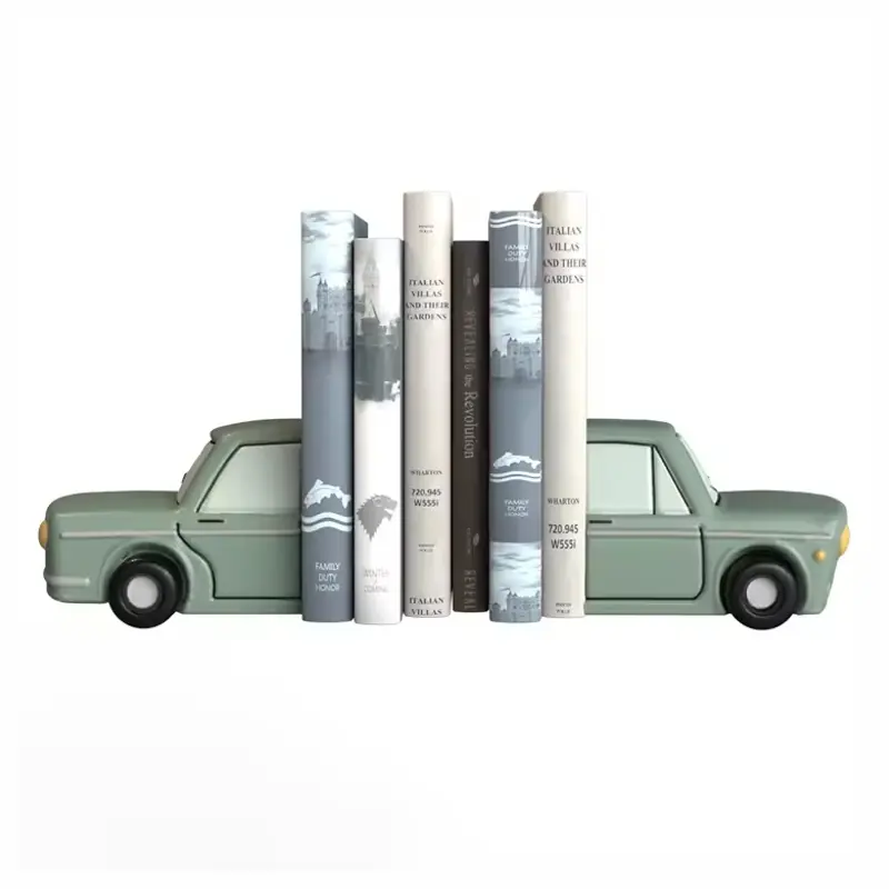 Green car-shaped bookends positioned at the ends of a book row