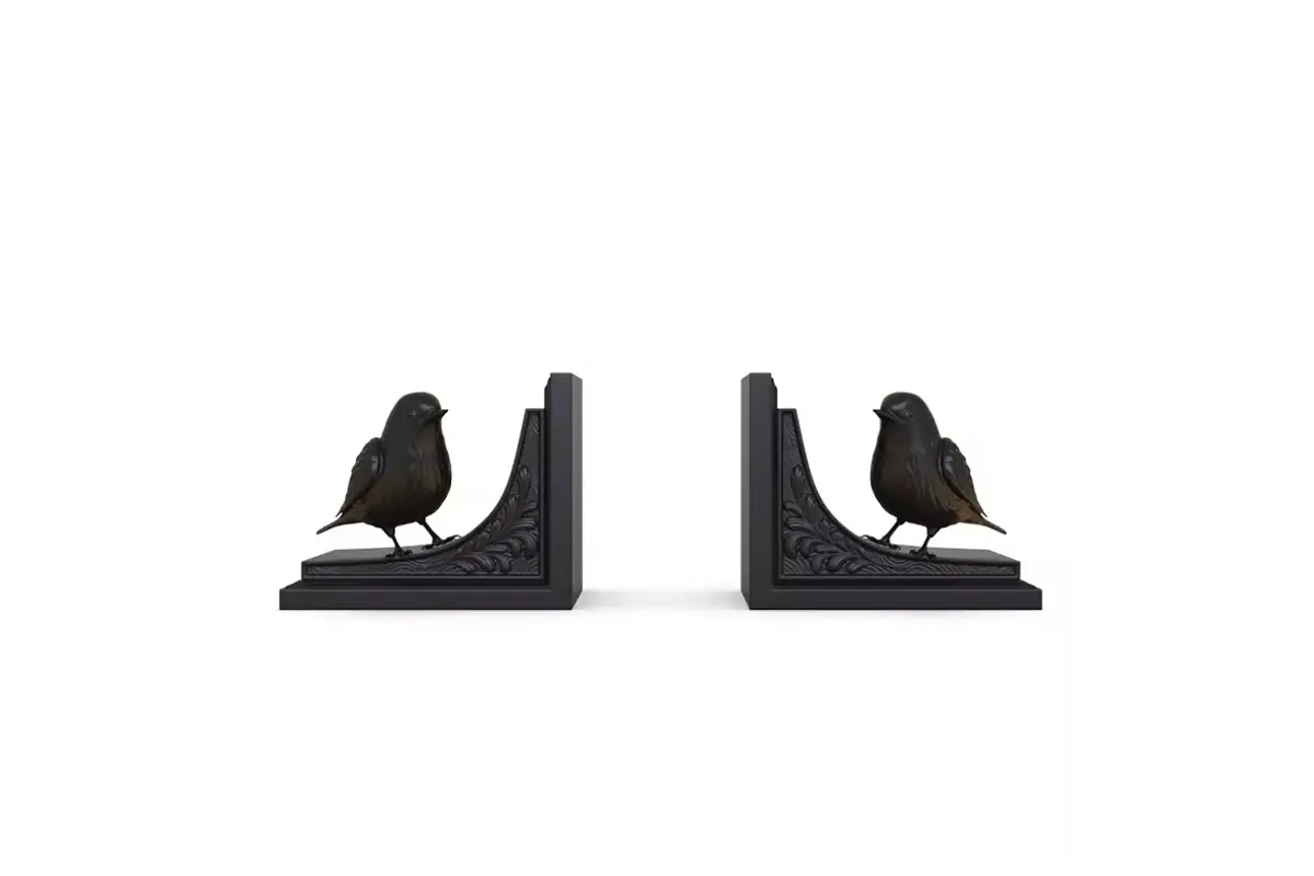 Black bird bookends on flat L-shaped supports