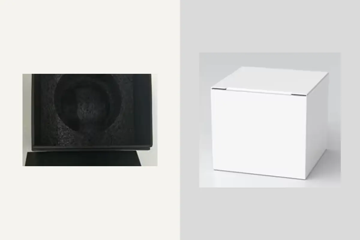 A fitted dark foam cavity beside a plain white gift box
