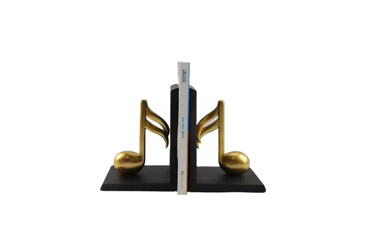 Gold-colored musical-note bookends on black L-shaped supports
