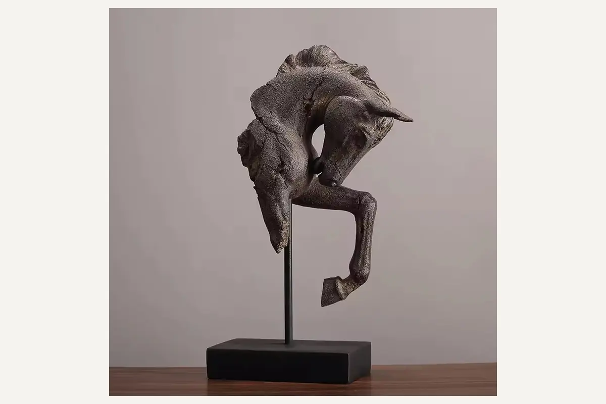 A curved horse head sculpture supported above a black display base