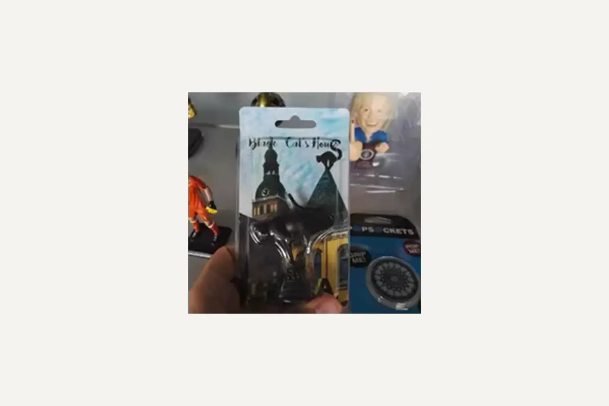A small souvenir product sealed on a printed hanging backing card