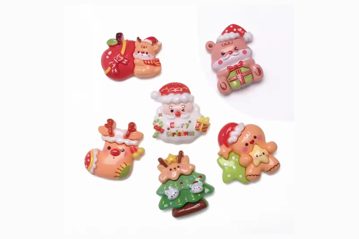 Christmas character refrigerator magnets including Santa and gingerbread shapes