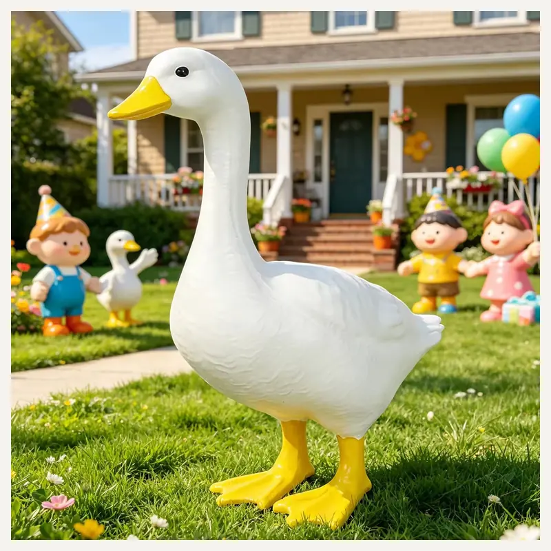 A white goose garden statue standing on a lawn