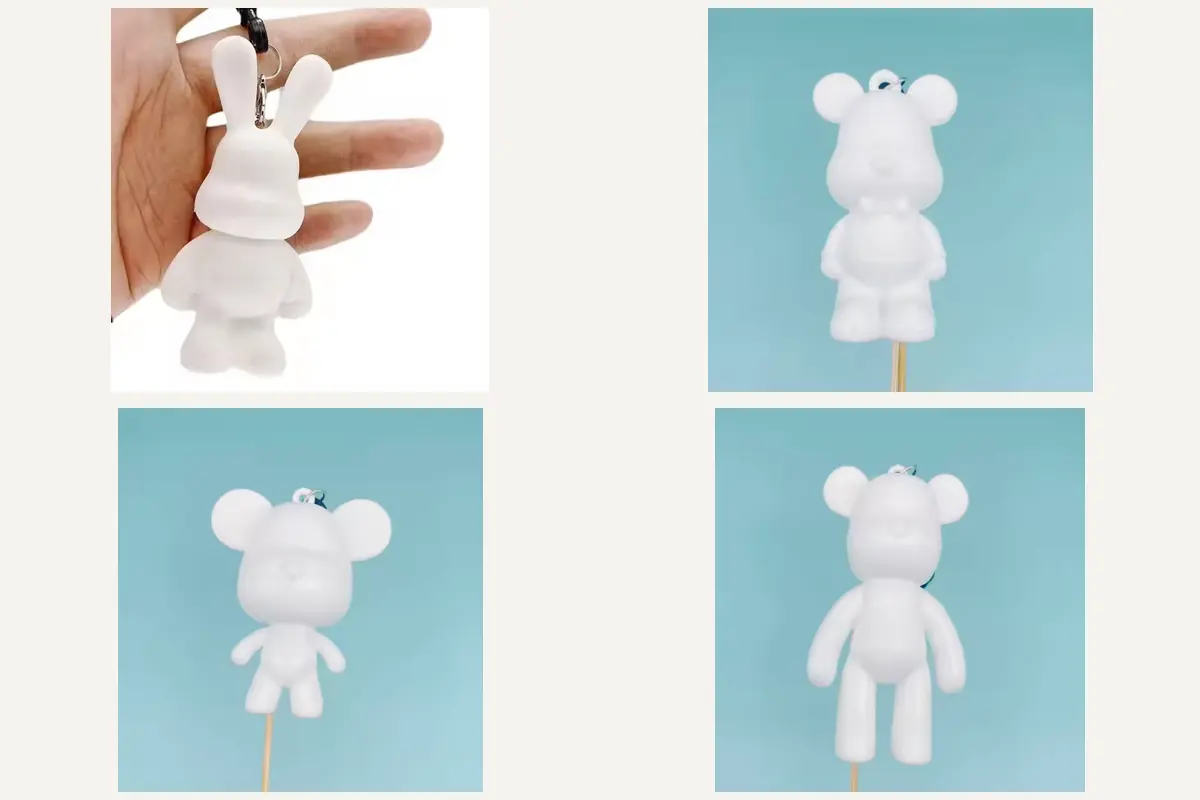 Unpainted keychain prototypes showing a rabbit, two mouse-like characters and a long-armed block-shaped character