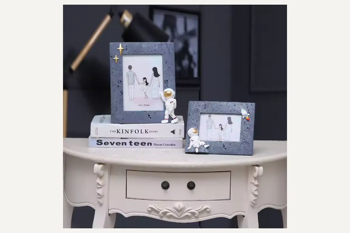 Astronaut-themed rectangular photo frames displayed in portrait and landscape orientations