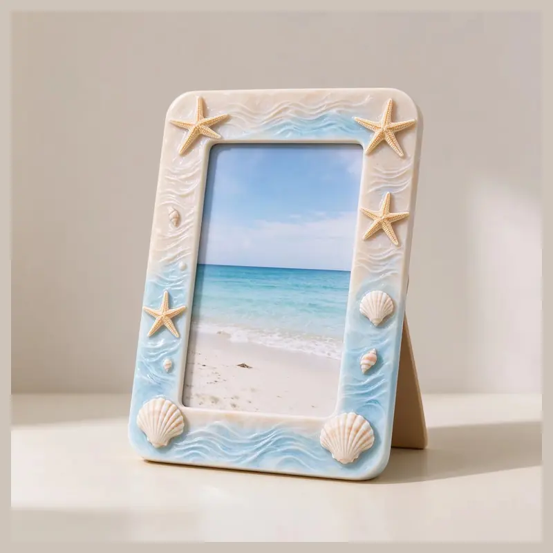 A coastal photo frame with starfish, shells and blue wave details