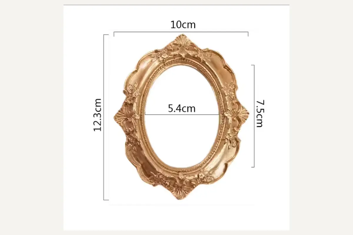 An oval miniature photo frame showing outer and inner opening dimensions