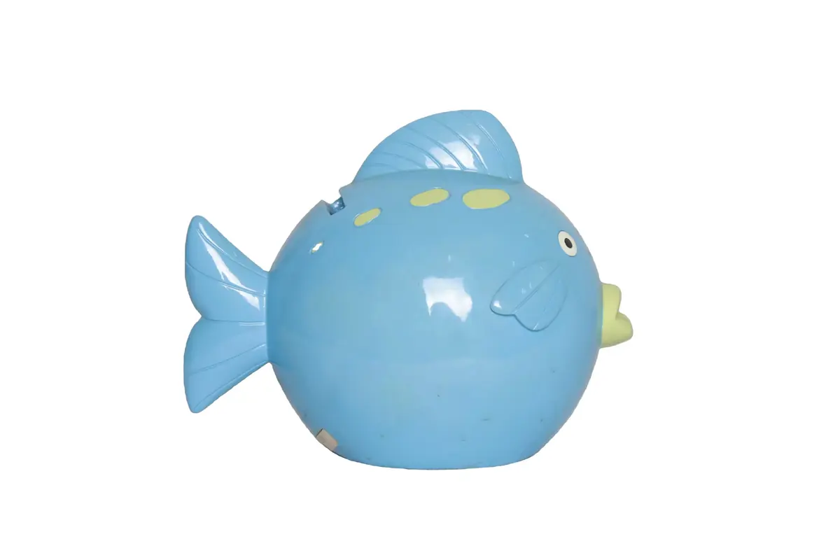 A glossy blue fish-shaped coin bank with raised fin details