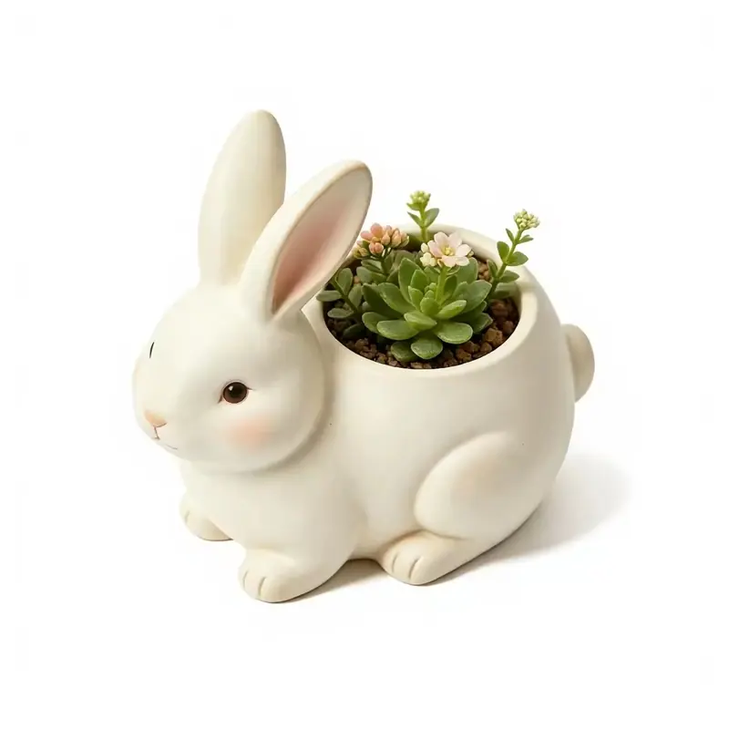 A white rabbit-shaped planter holding a small succulent