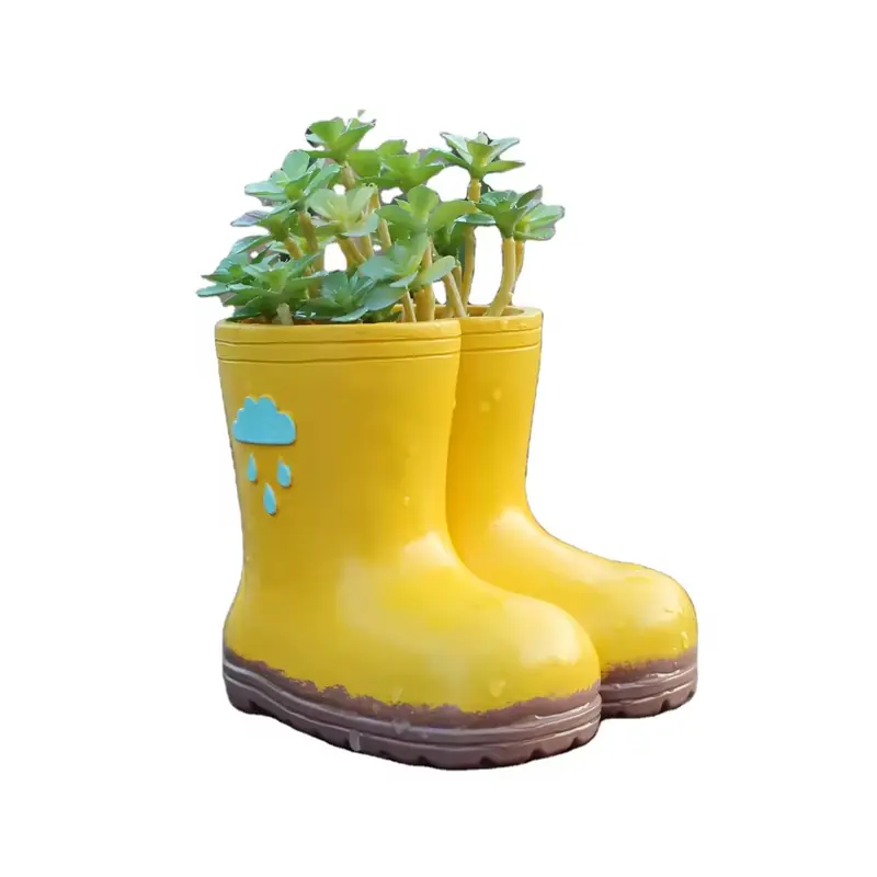 Yellow rain-boot planters holding small green plants