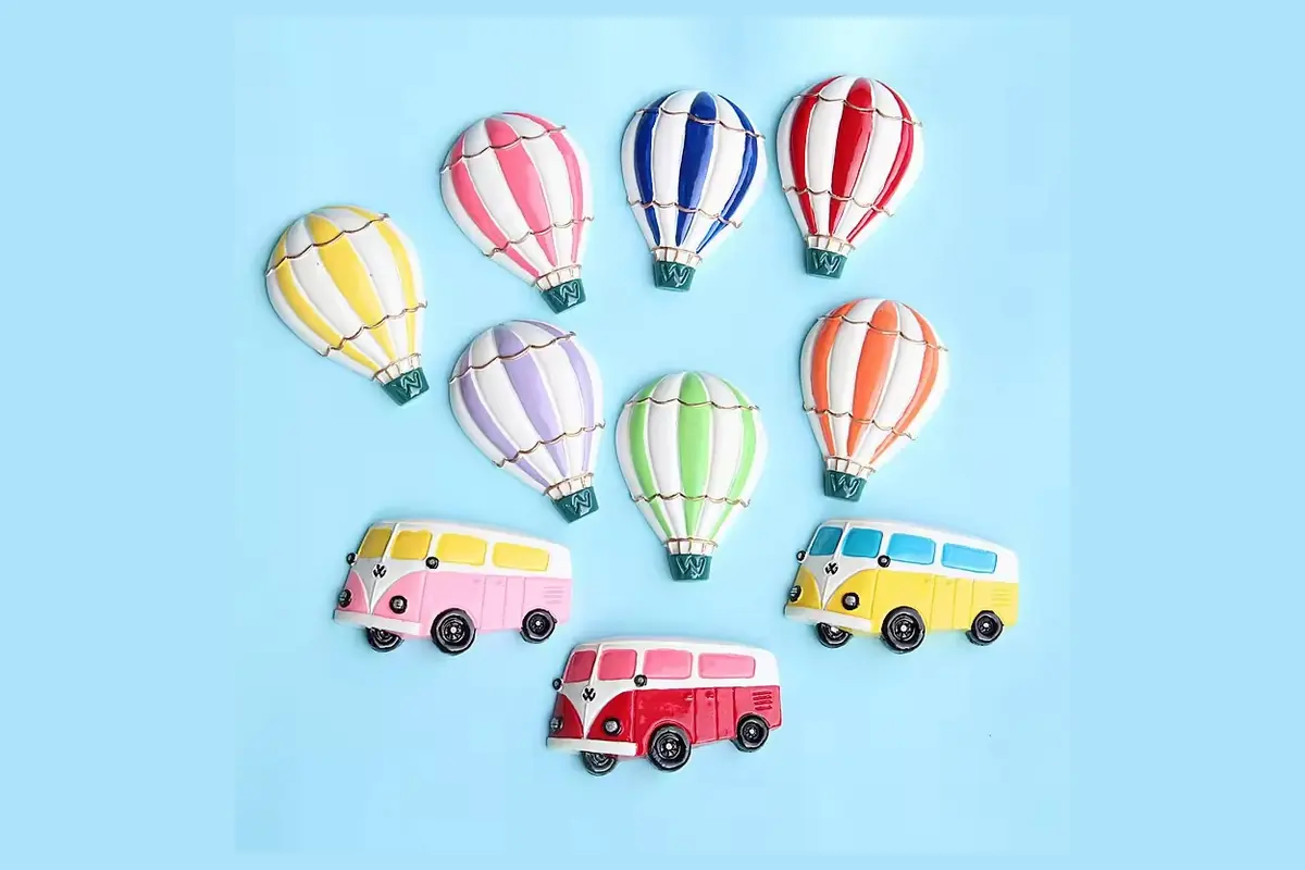 Colorful hot air balloon and camper van refrigerator magnets