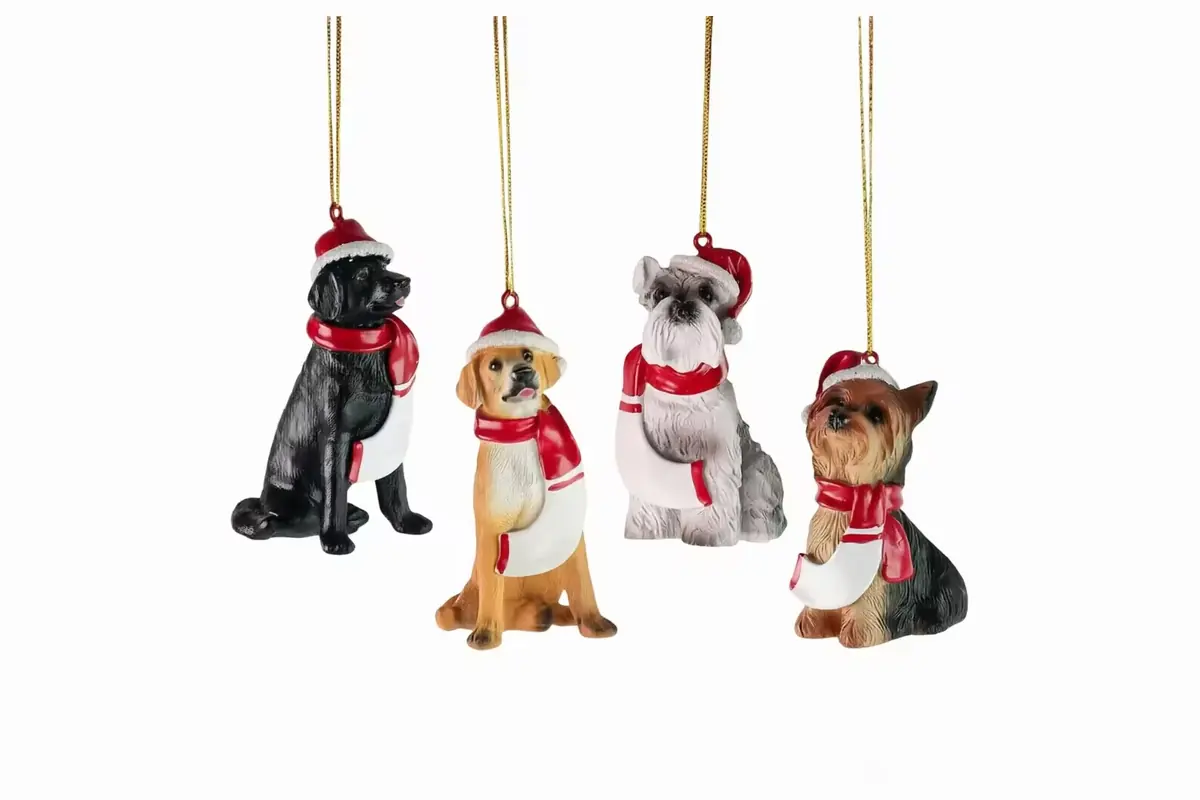 Four hanging dog ornaments with scarves and Christmas hats